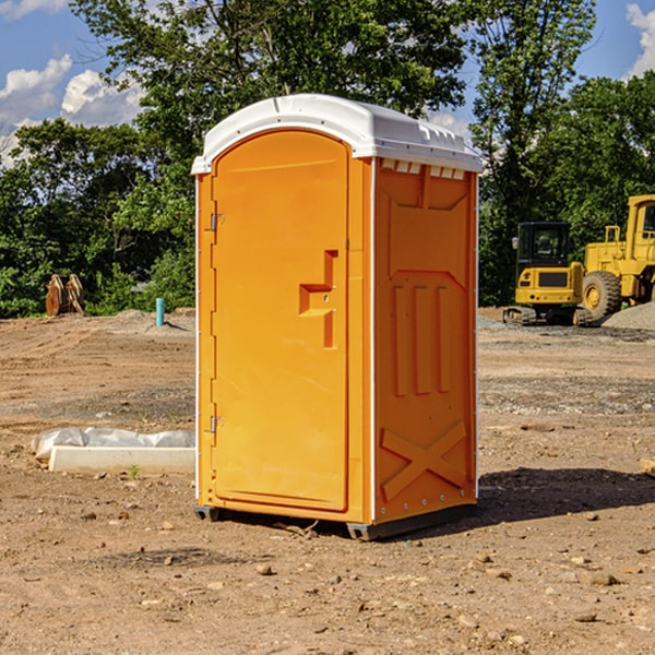 how often are the portable restrooms cleaned and serviced during a rental period in Tullos